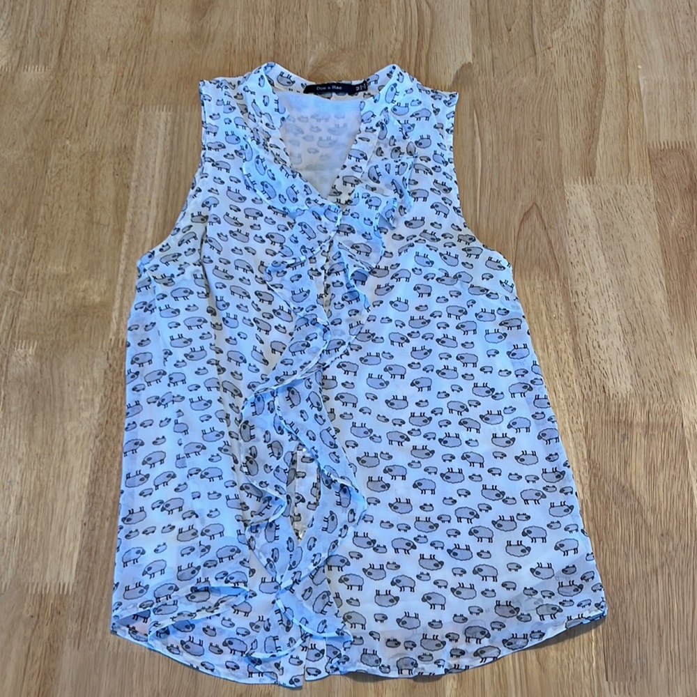 SHEEP!  Sleeveless blouse, button up, flouncey finish at neck & down the front.
